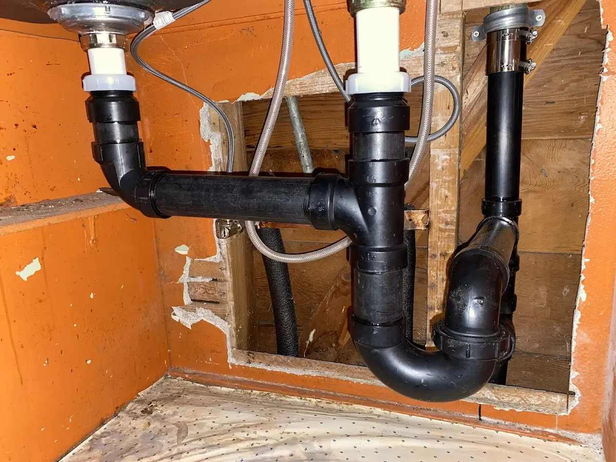 Professional Garbage Disposal Repair equipment and tools on the job in Kenedy